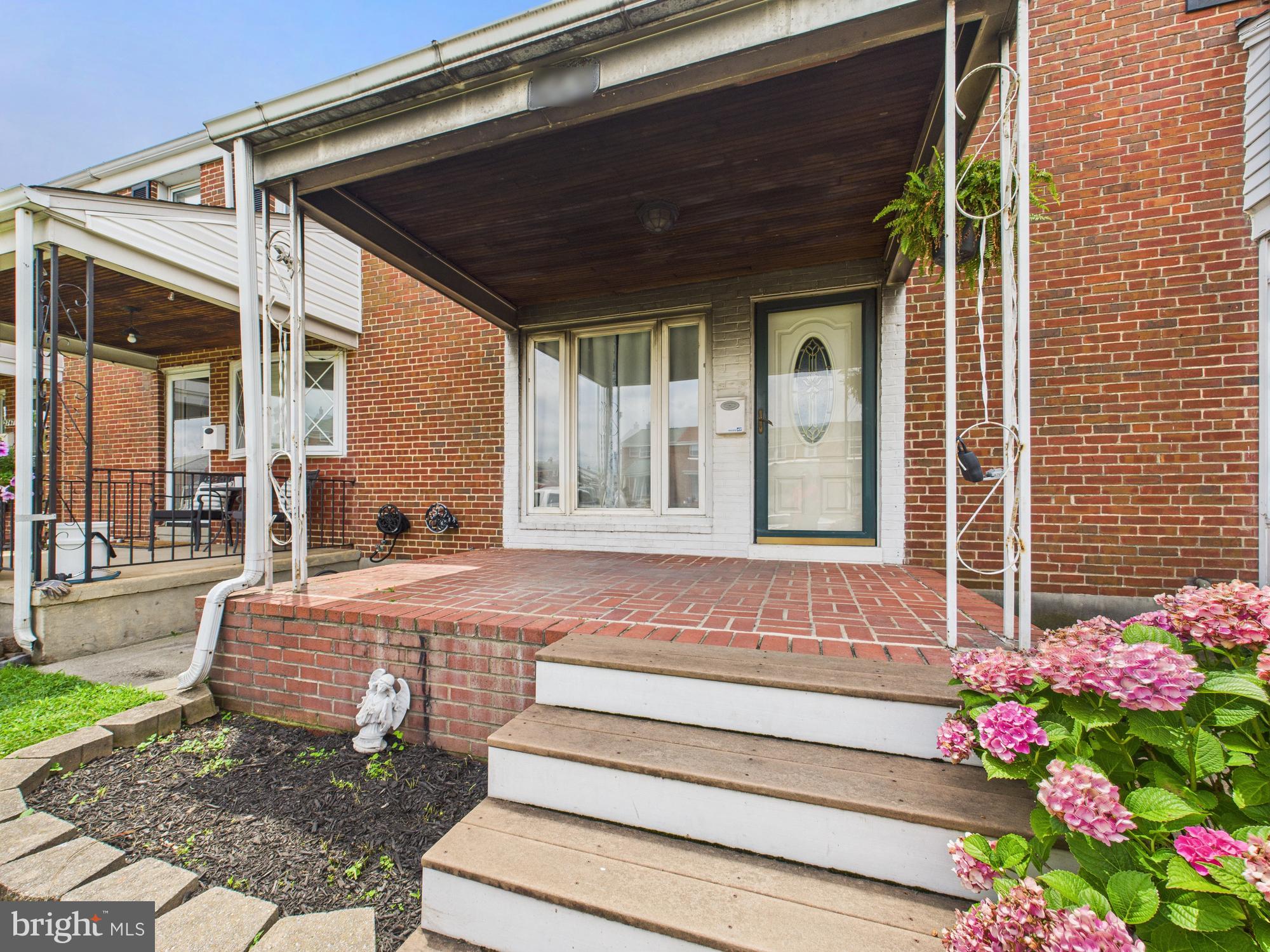 2743 Kirkleigh Road Dundalk, MD 21222 - Photo 8 of 31 a front view of a house with a porch