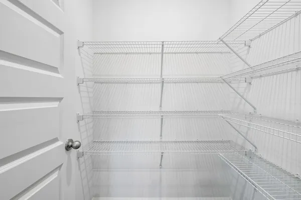 a view of an empty walk in closet