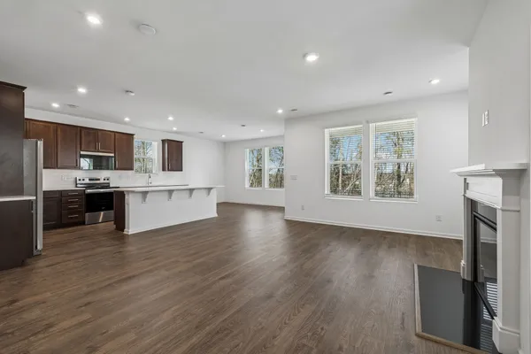 a view of kitchen with cabinets and wooden floor