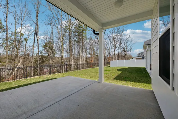 a view of backyard with tub
