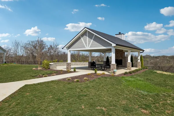 a view of a house with a yard porch and sitting area