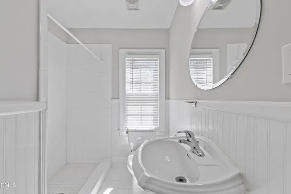 a bathroom with a sink and a window