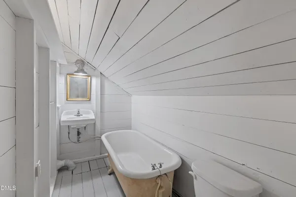 a bathroom with a toilet and a sink