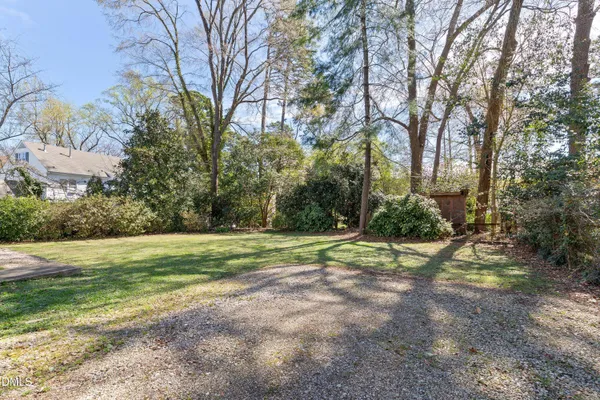 a view of outdoor space with trees all around