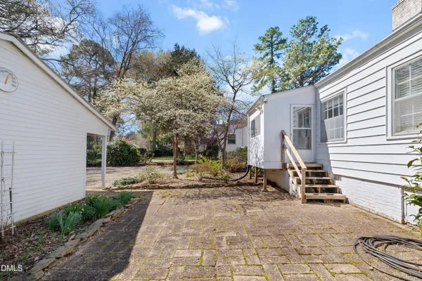 a view of a backyard with sitting area