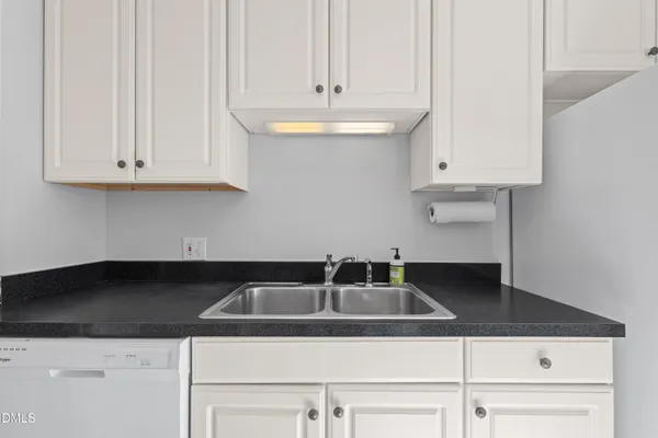 a kitchen with a sink and cabinets
