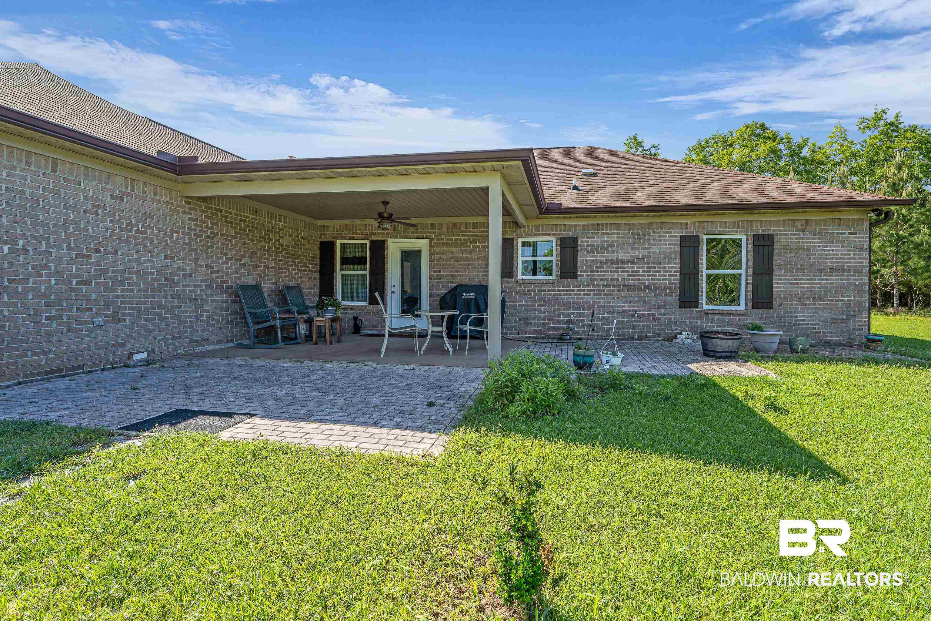 18255 Cactus Court Elberta, AL 36530 - Photo 6 of 53 Rear view of house featuring a patio, a yard, brick siding, a ceiling fan, and roof with shingles