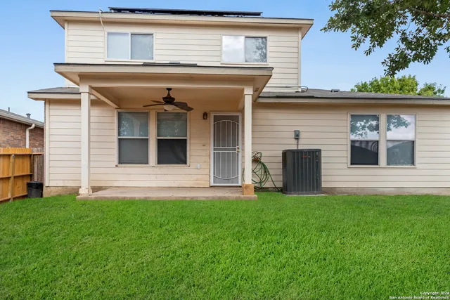 a view of house with yard