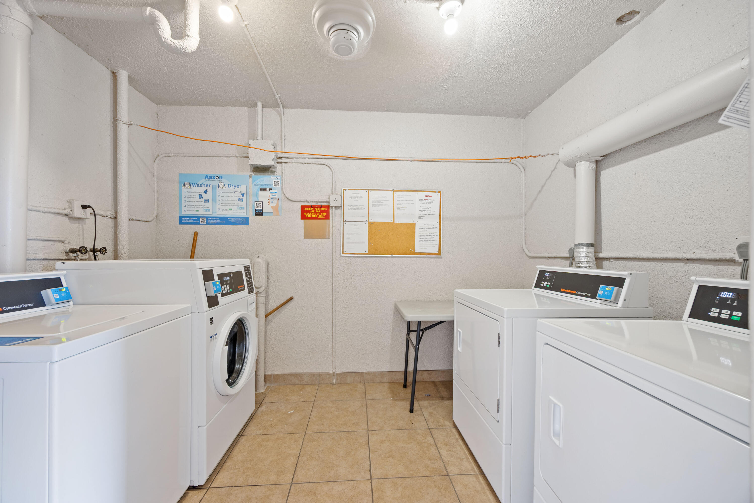 230 Northeast 26th Avenue, Unit 206 Boynton Beach, FL 33435 - Photo 25 of 25 a utility room with dryer and washer