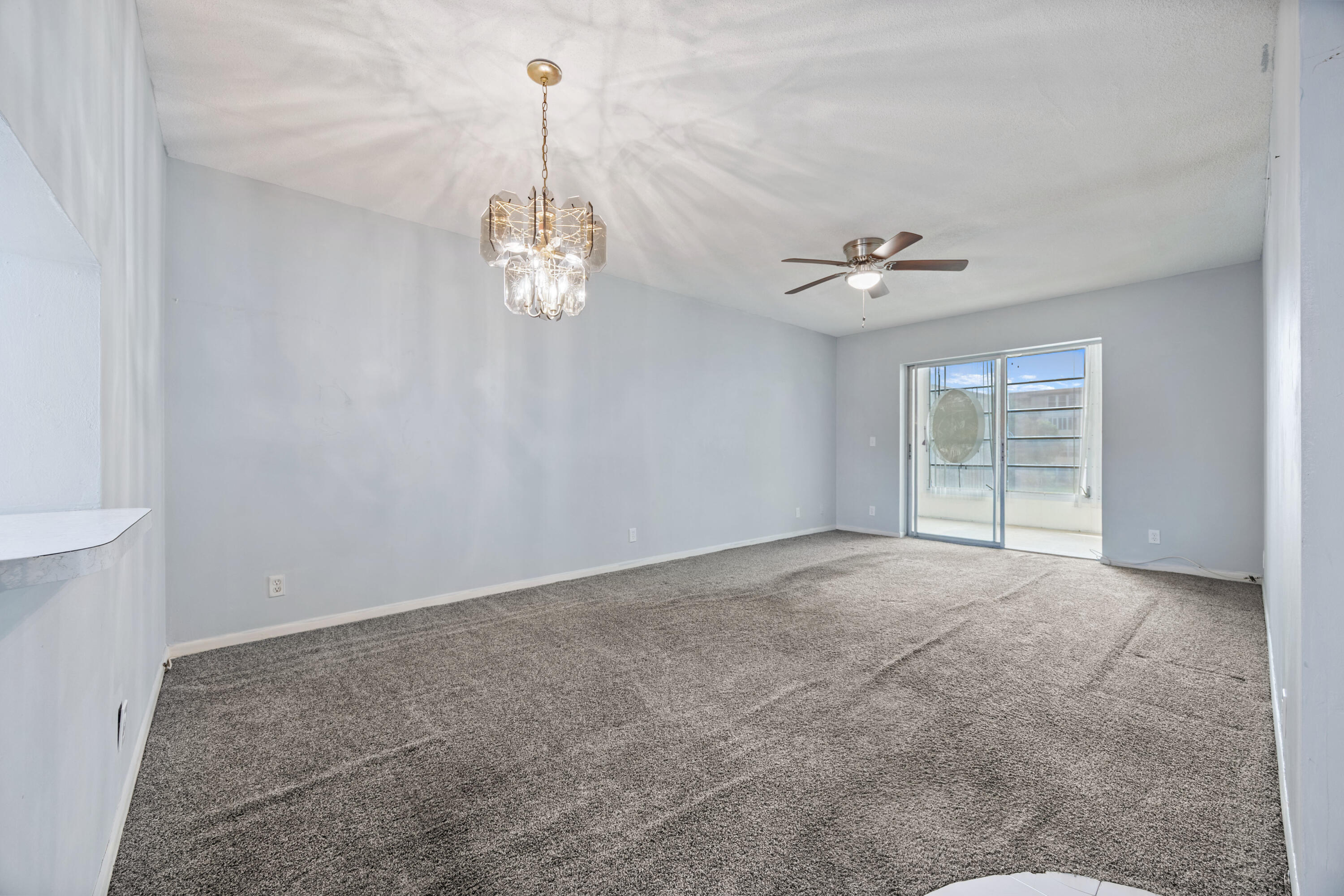 230 Northeast 26th Avenue, Unit 206 Boynton Beach, FL 33435 - Photo 3 of 25 a view of a livingroom with a ceiling fan window and a ceiling fan