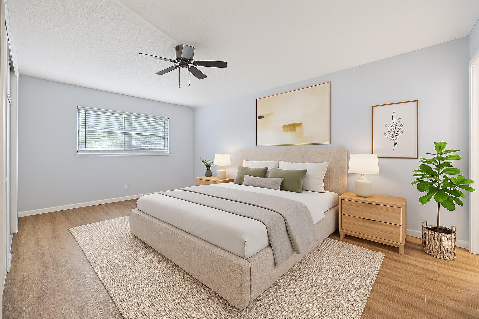 230 Northeast 26th Avenue, Unit 206 Boynton Beach, FL 33435 - Photo 9 of 25 a bedroom with bed and a painting on the wall