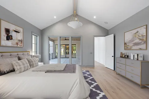 a bedroom with a bed and a couch