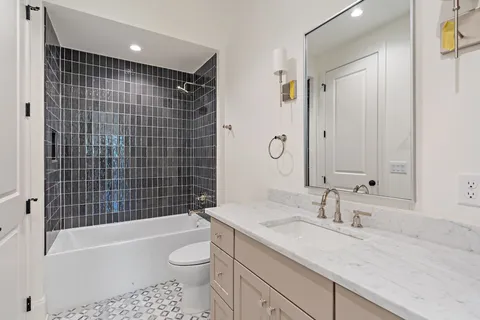 a view of a hallway with closet and wooden floor