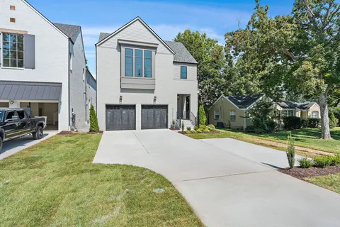 a view of a hallway with closet and wooden floor
