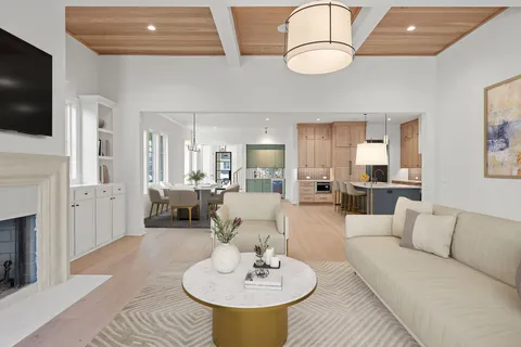 a view of an empty room with window and fire place