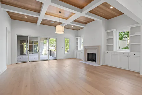a view of large kitchen with a sink stainless steel appliances and cabinets