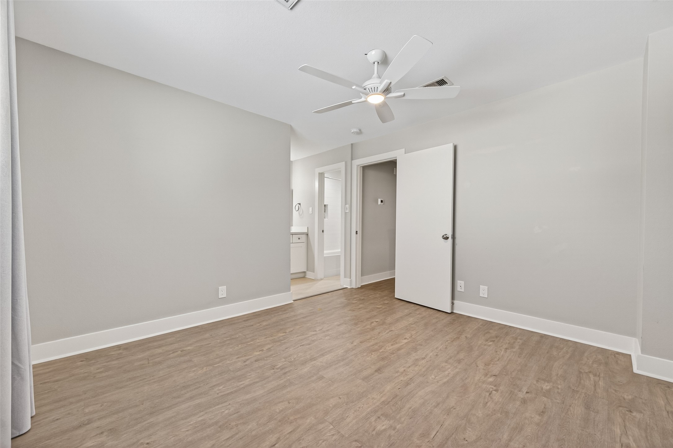 1805 Witte Road, Unit 3 Houston, TX 77080 - Photo 23 of 33 a view of an empty room with wooden floor