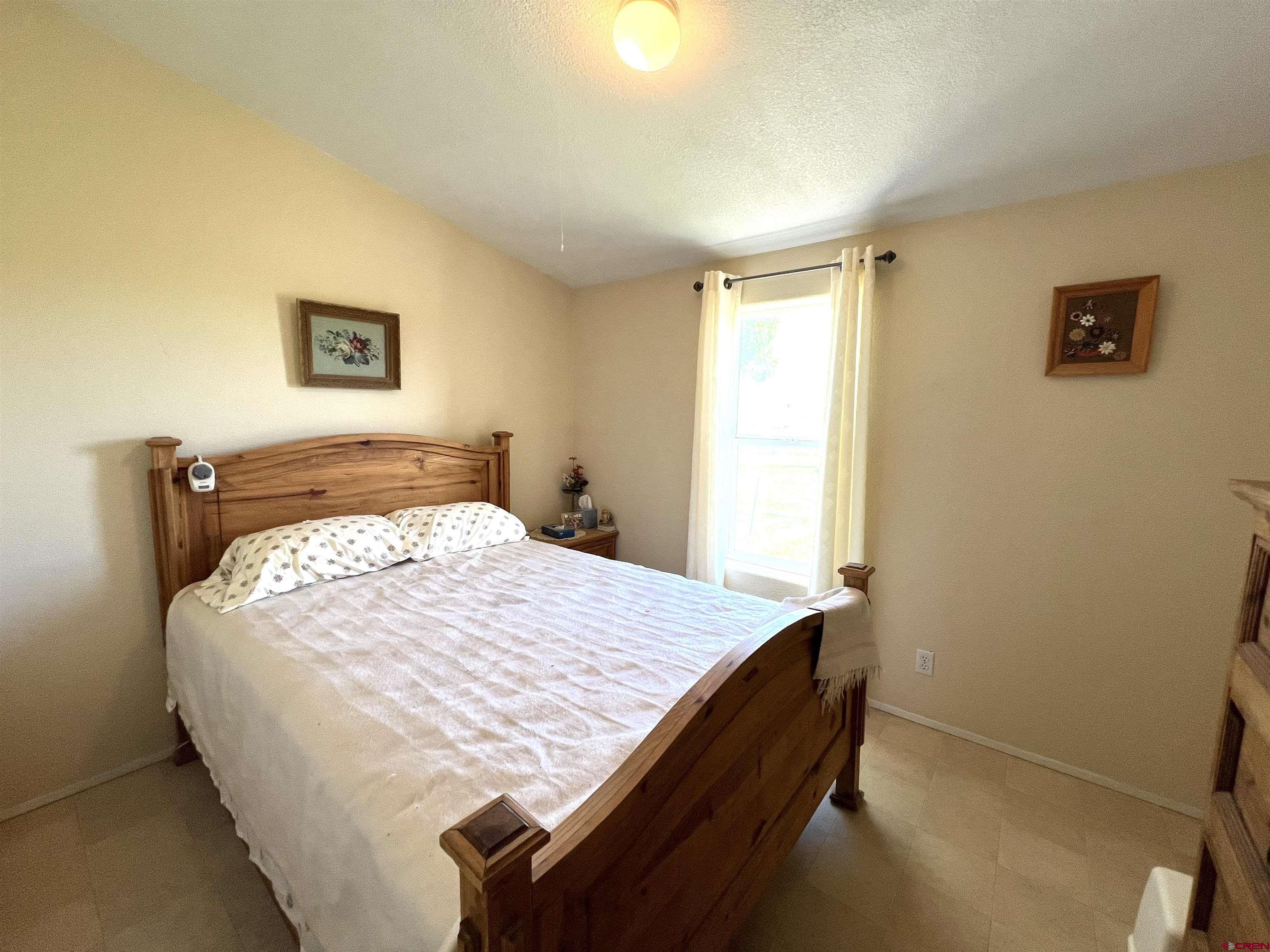 21179 Rd C.6 Cortez, CO 81321 - Photo 12 of 33 a bedroom with a bed and a window