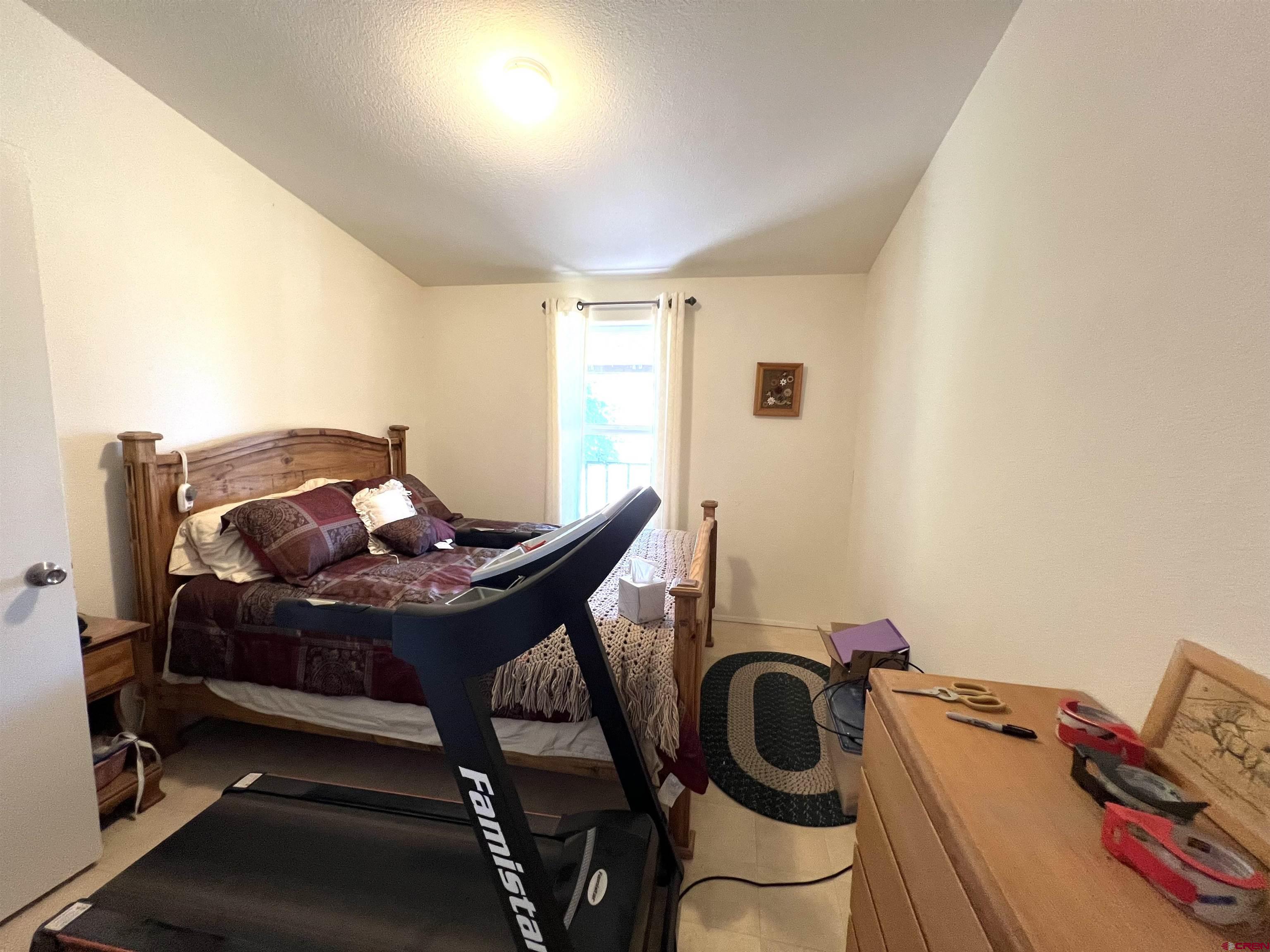 21179 Rd C.6 Cortez, CO 81321 - Photo 13 of 33 a view of a workspace with furniture and bedroom