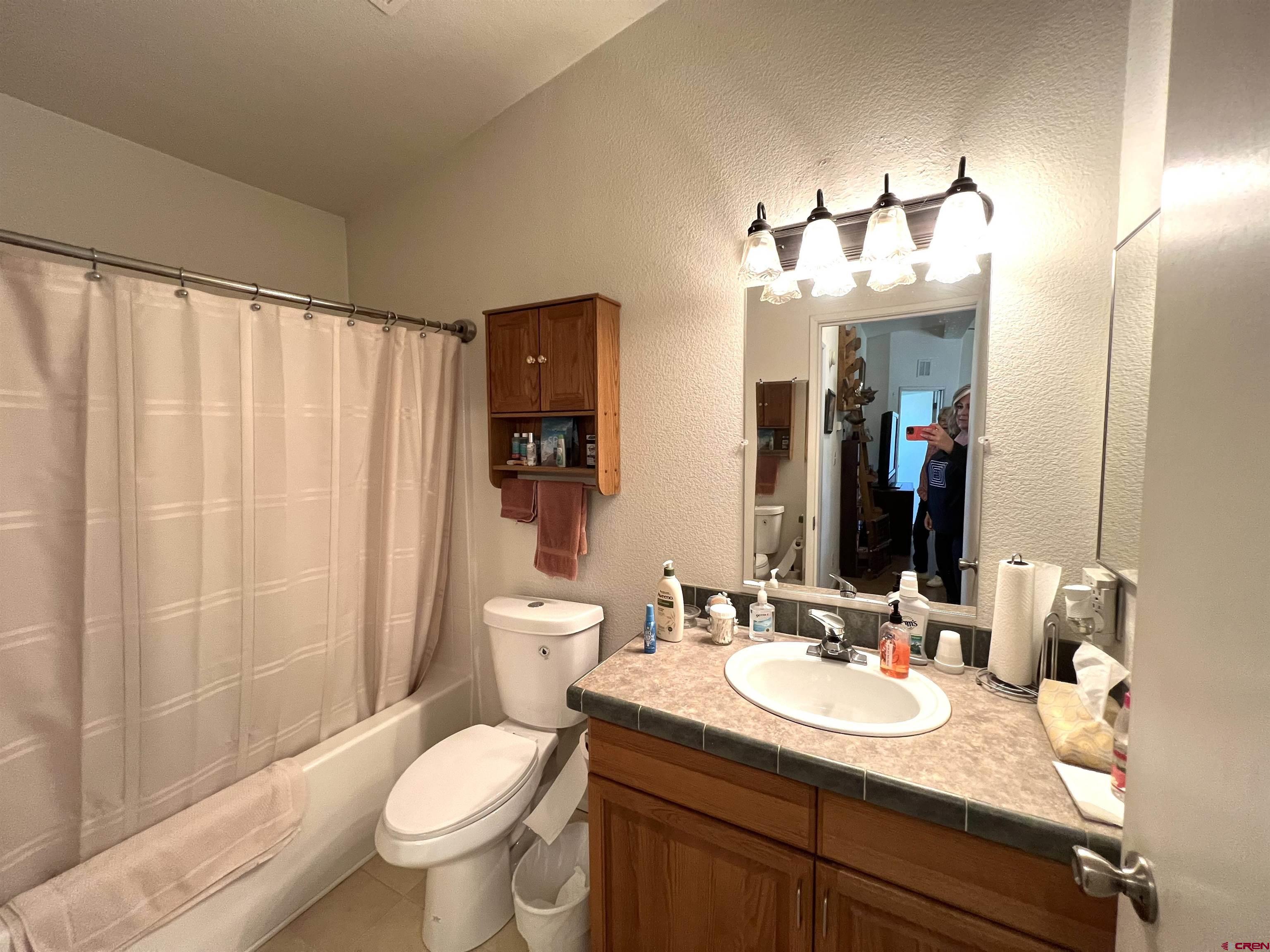 21179 Rd C.6 Cortez, CO 81321 - Photo 14 of 33 a bathroom with a sink and a mirror