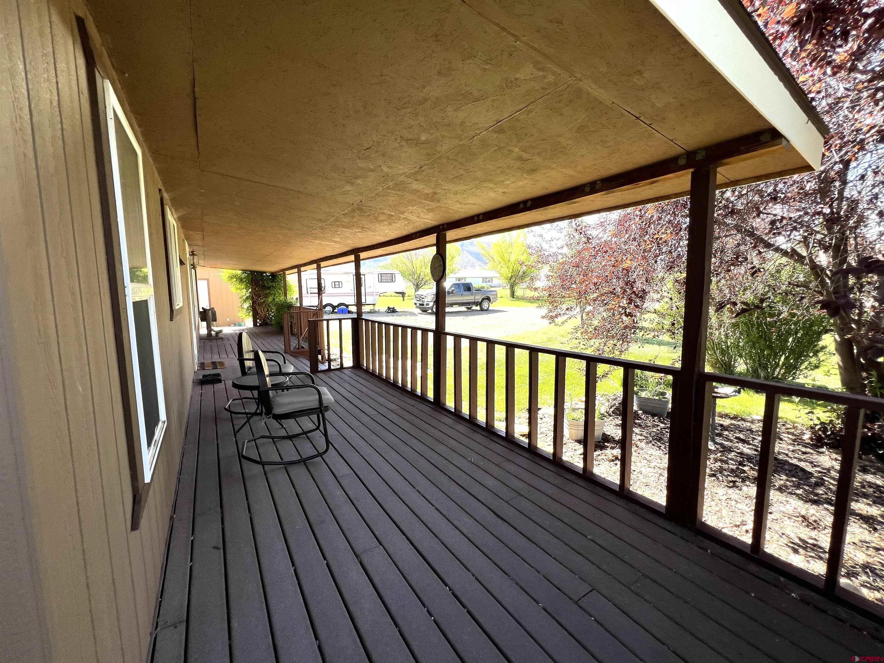 21179 Rd C.6 Cortez, CO 81321 - Photo 16 of 33 a view of a chairs and table in deck with wooden floor