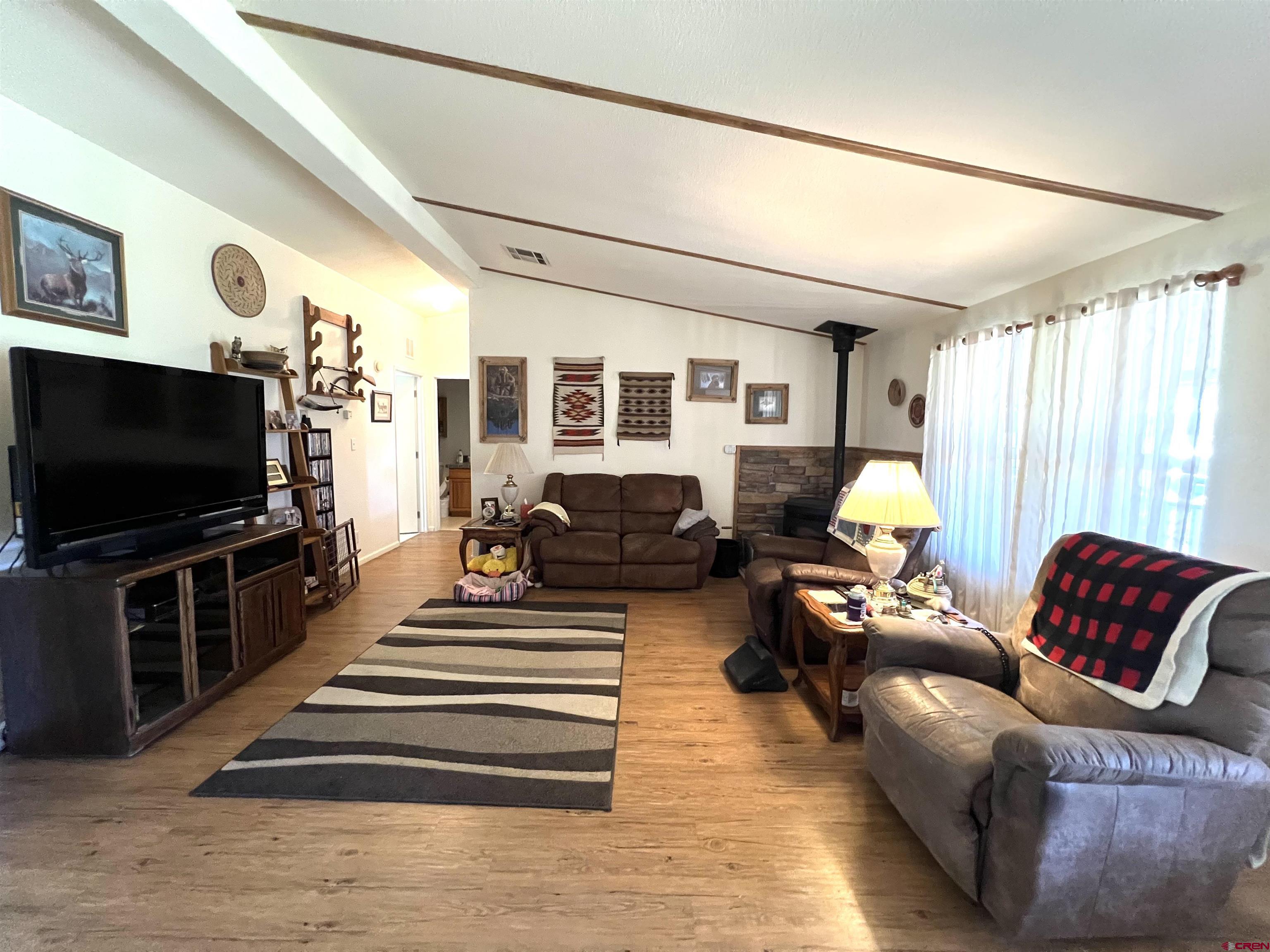 21179 Rd C.6 Cortez, CO 81321 - Photo 4 of 33 a living room with furniture and a flat screen tv