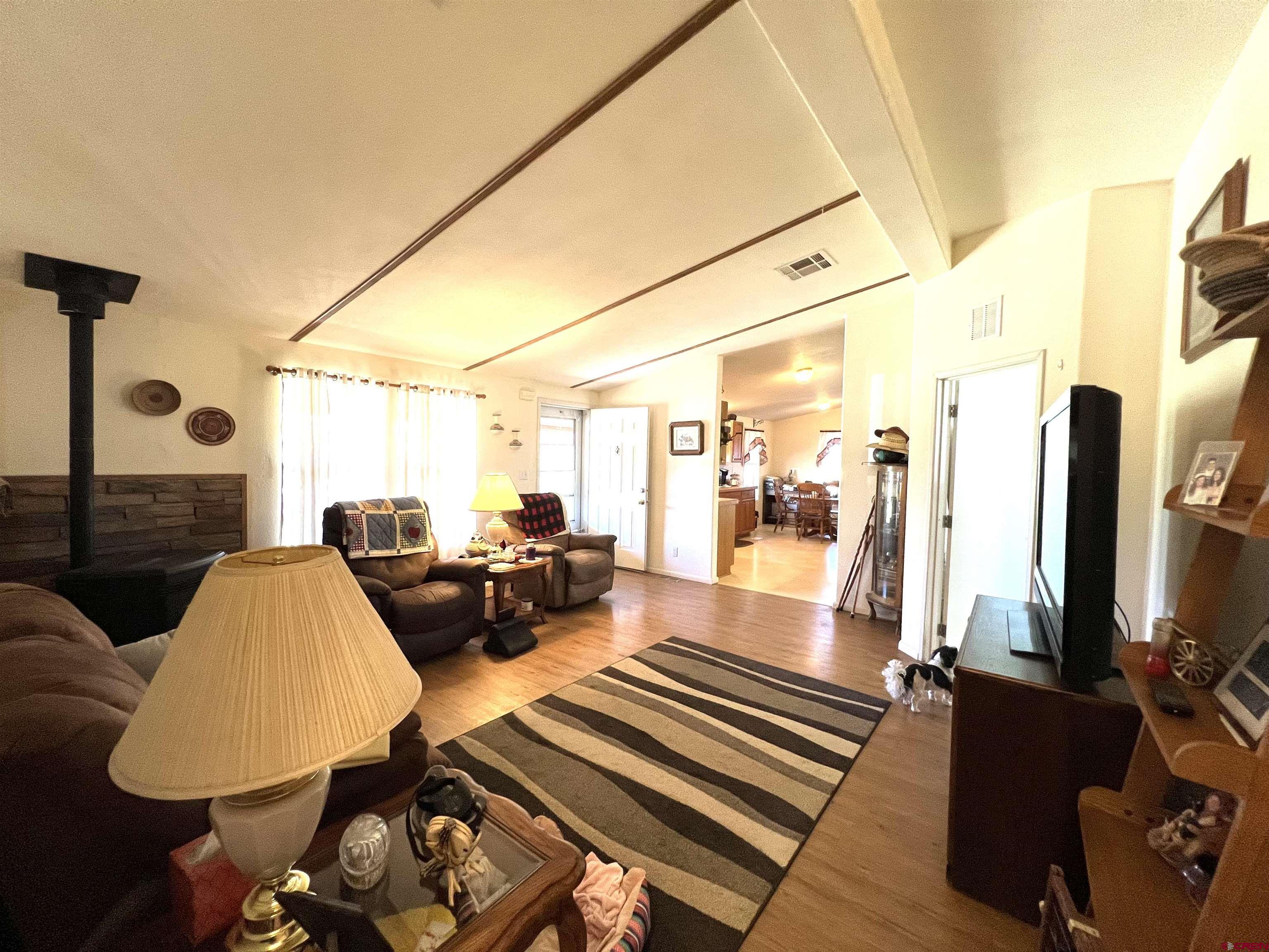 21179 Rd C.6 Cortez, CO 81321 - Photo 5 of 33 a living room with furniture and a flat screen tv