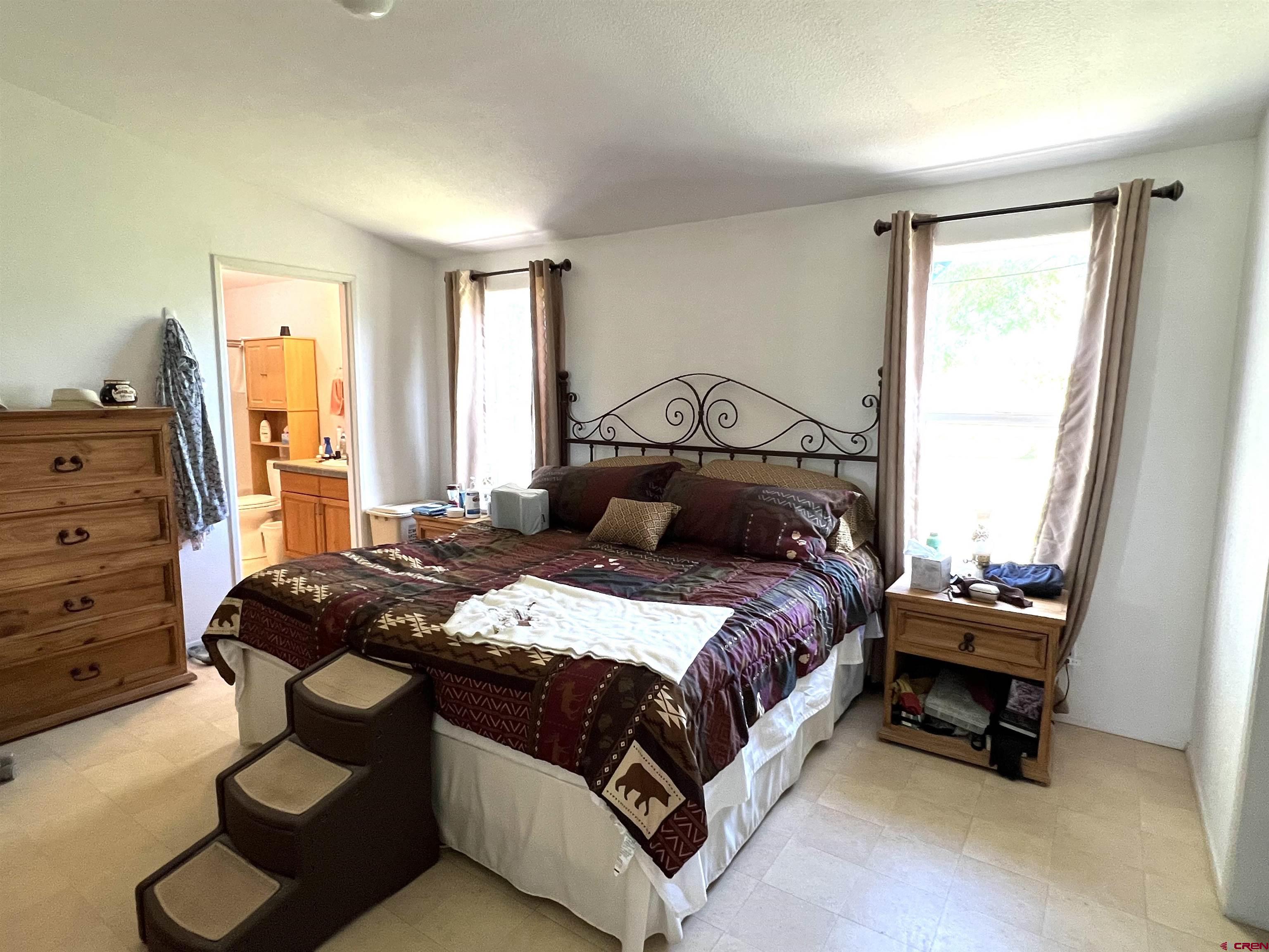 21179 Rd C.6 Cortez, CO 81321 - Photo 10 of 33 a bedroom with a bed and a window