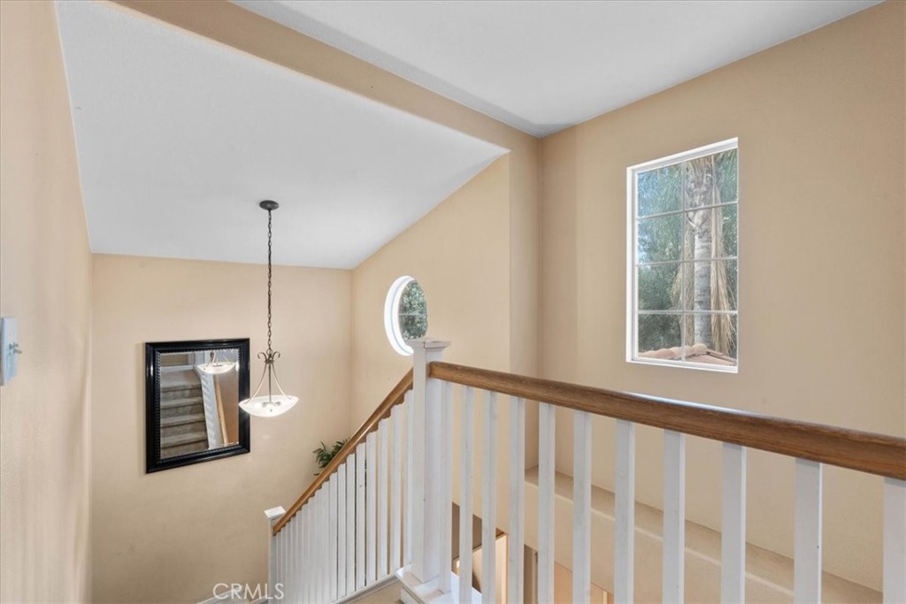 1474 Albillo Loop Perris, CA 92571 - Photo 15 of 35 a view of a hallway with windows