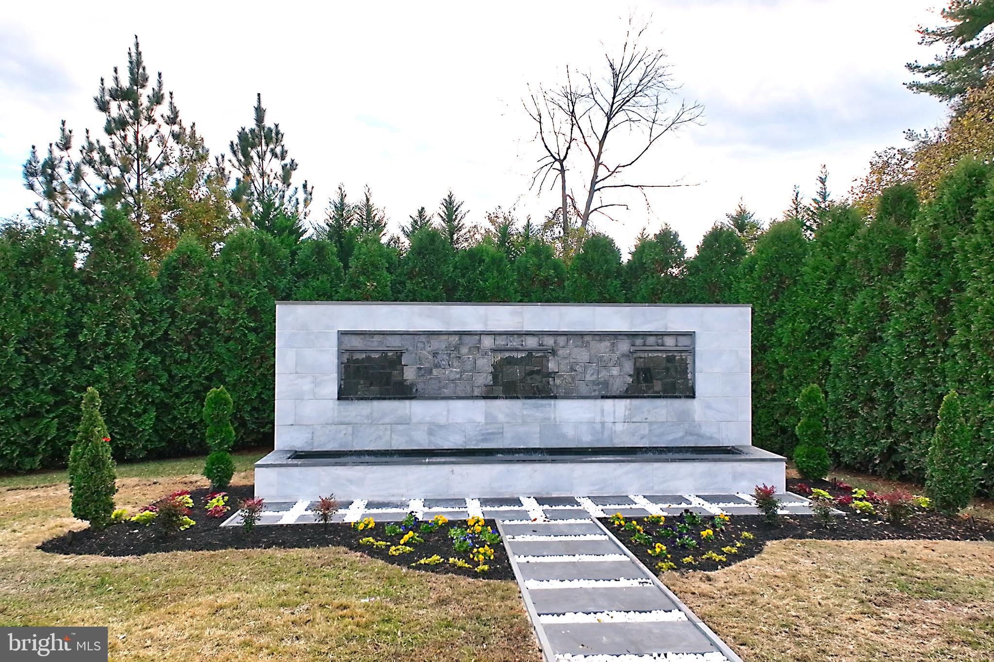 1181 Ballantrae Lane McLean, VA 22101 - Photo 4 of 85 Serene memorial surrounded by lush greenery.