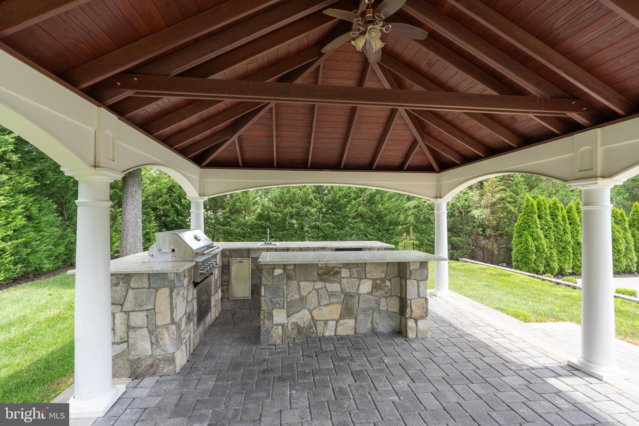 1181 Ballantrae Lane McLean, VA 22101 - Photo 73 of 85 a view of a patio with table and chairs under an umbrella