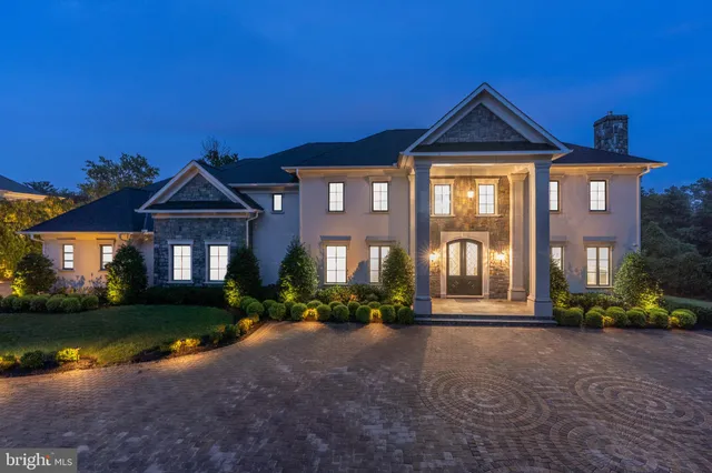 a view of a room with furniture and a window