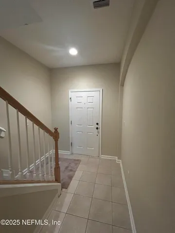 a view of entryway with wooden floor