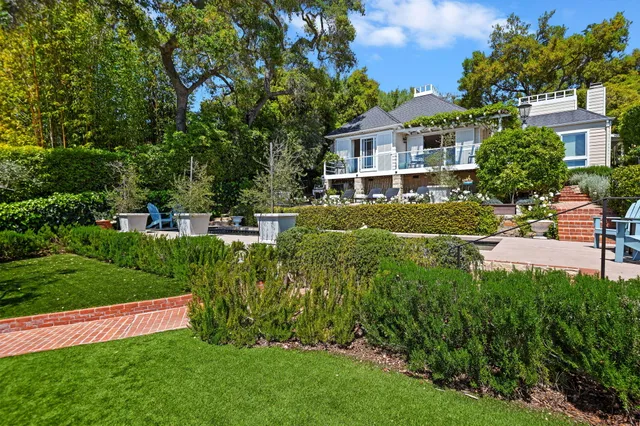 a view of a house with a garden