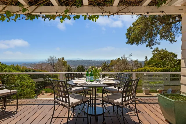 an outdoor space with patio and mountain view