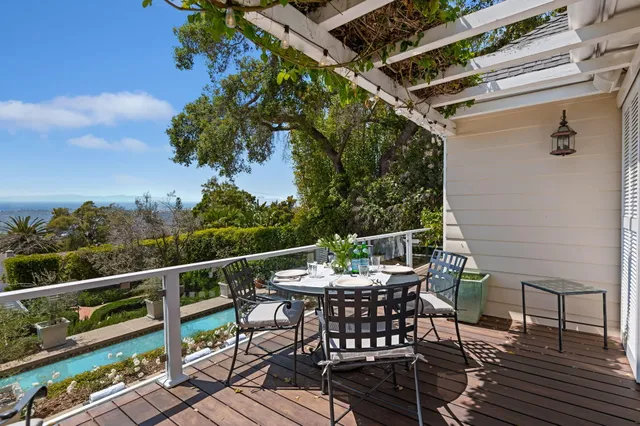 a view of a chairs and table on the deck