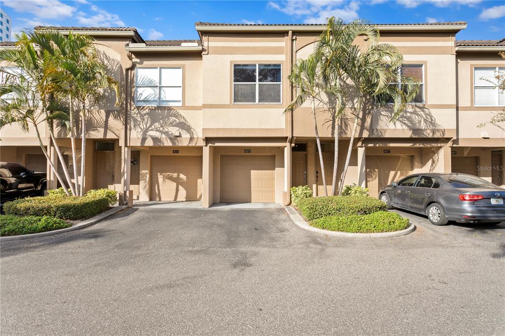 809 Normandy Trace Road Tampa, FL 33602 - Photo 1 of 1 a front view of a house with a garden and plants