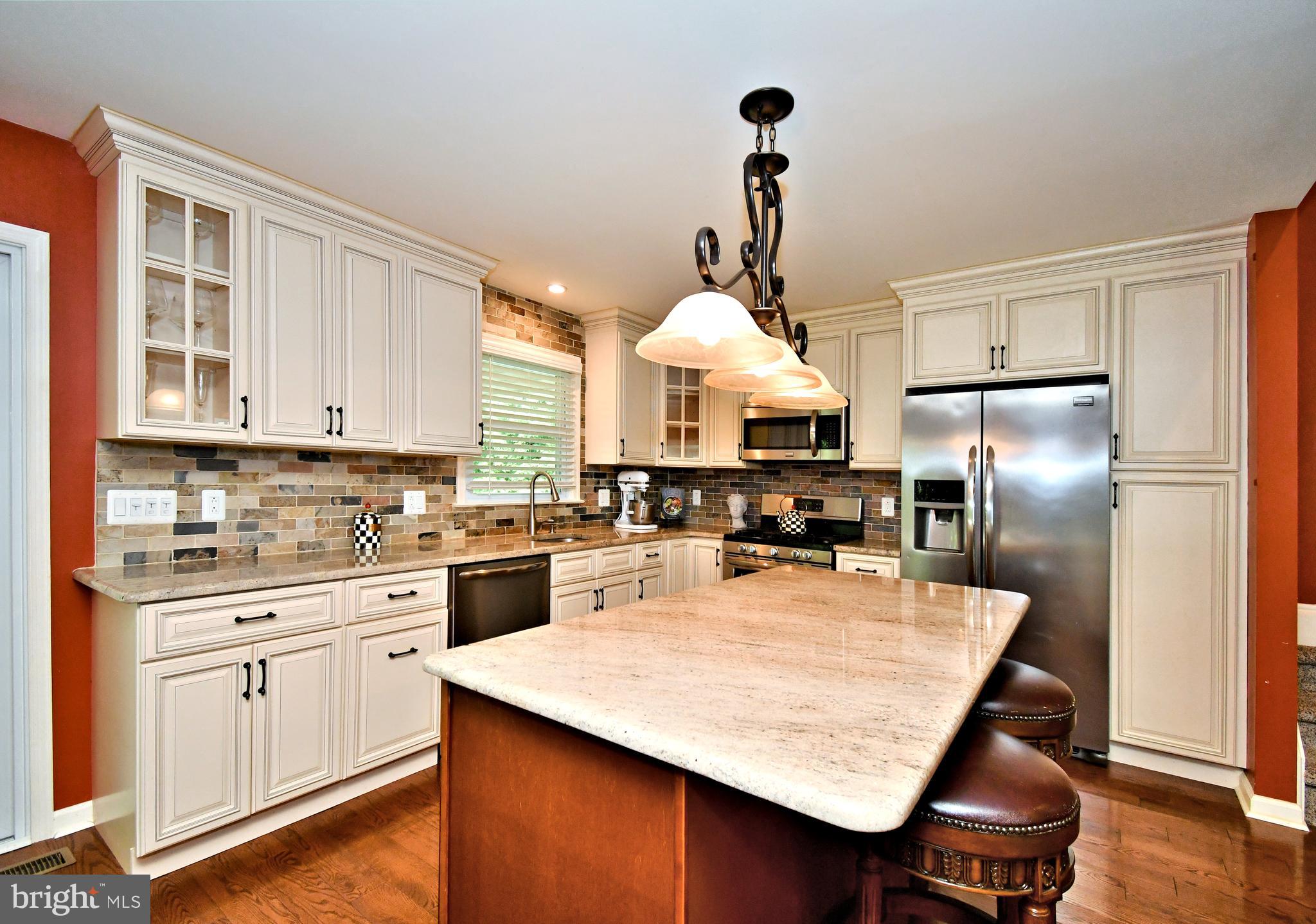 1014 Anna Road Huntingdon Valley, PA 19006 - Photo 12 of 54 a kitchen with kitchen island a counter tops pace a sink appliances and cabinets
