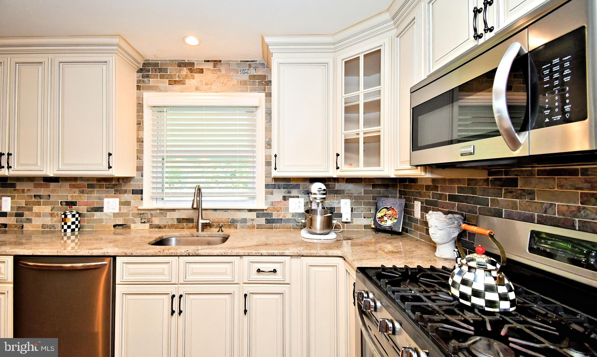 1014 Anna Road Huntingdon Valley, PA 19006 - Photo 15 of 54 a kitchen with stainless steel appliances a stove a sink and a microwave