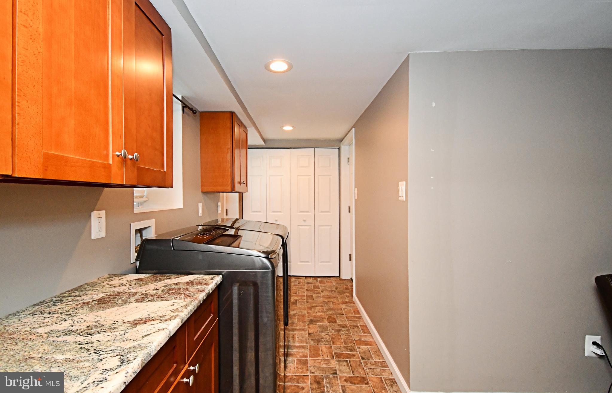1014 Anna Road Huntingdon Valley, PA 19006 - Photo 31 of 54 a kitchen with a sink a stove and cabinets