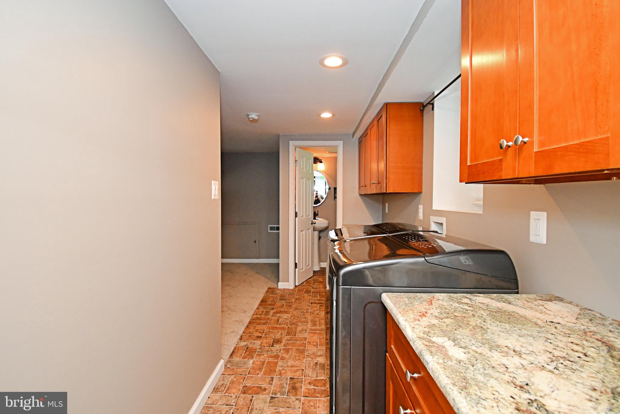 1014 Anna Road Huntingdon Valley, PA 19006 - Photo 34 of 54 a kitchen with a stove a sink and a microwave