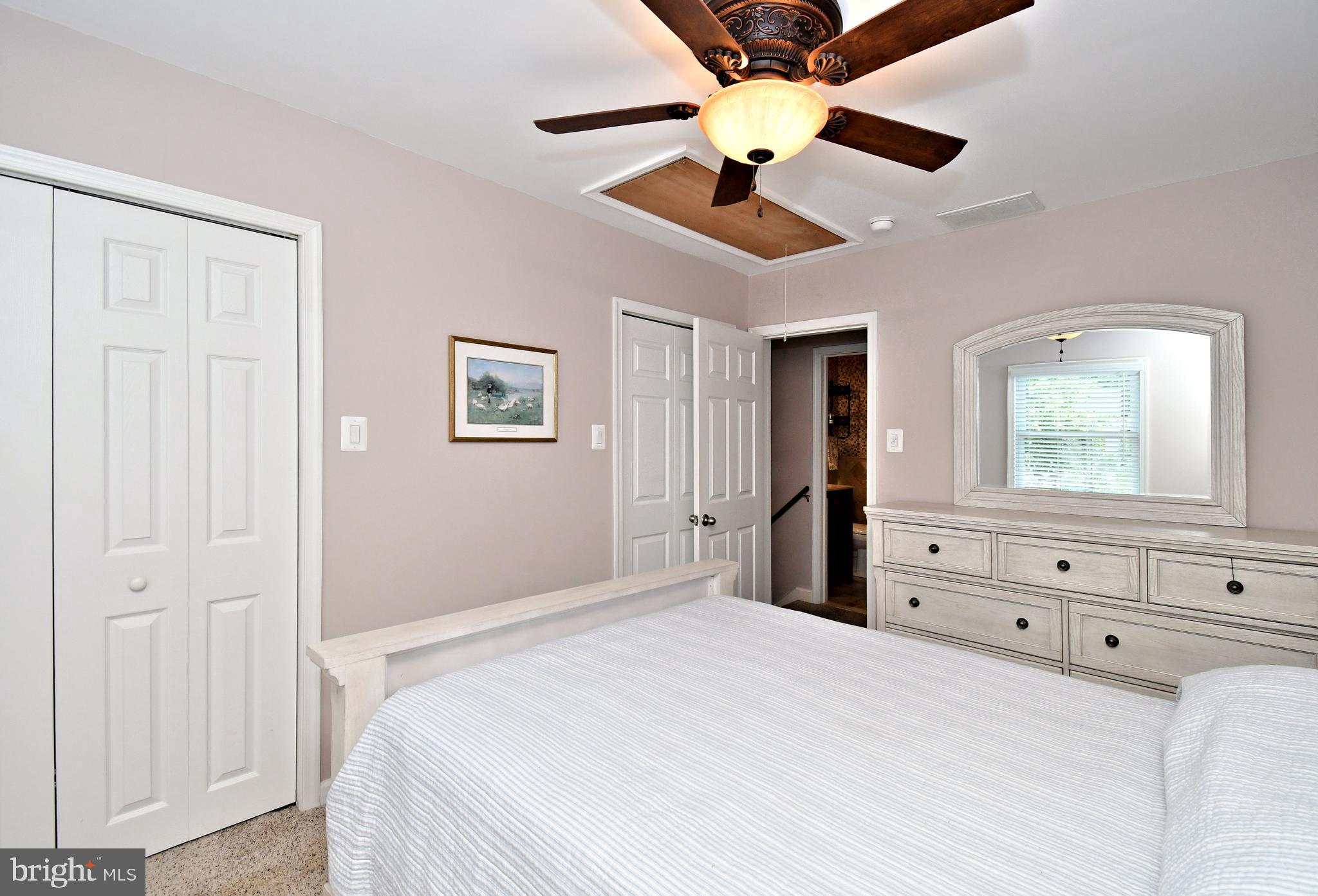 1014 Anna Road Huntingdon Valley, PA 19006 - Photo 36 of 54 a bedroom with a bed and a chandelier fan