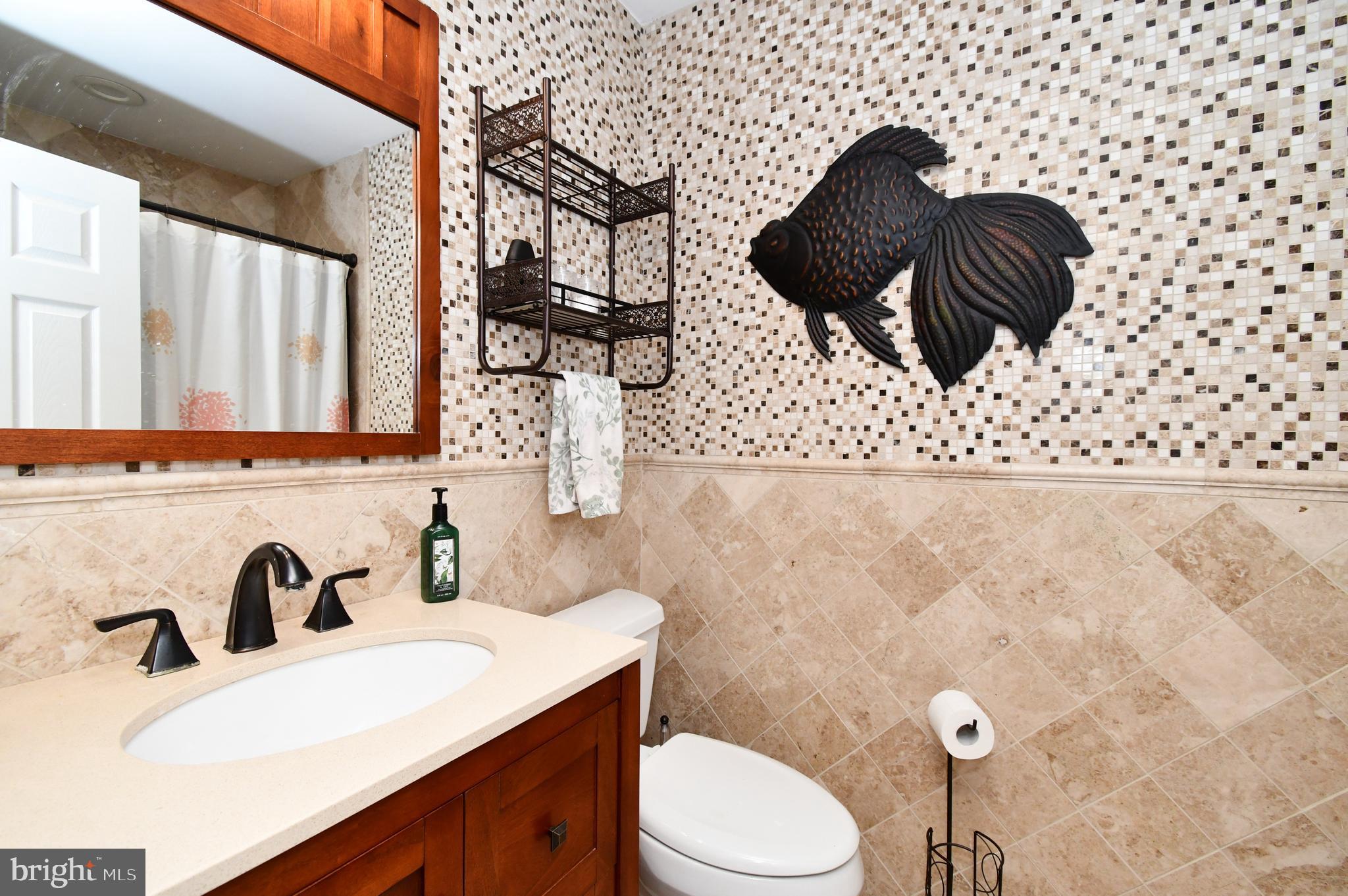 1014 Anna Road Huntingdon Valley, PA 19006 - Photo 39 of 54 a bathroom with a sink toilet and mirror