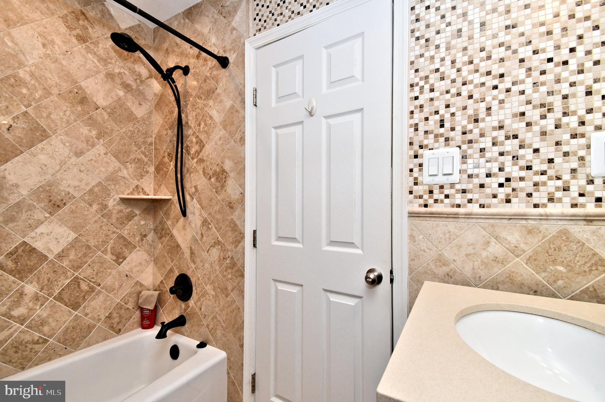 1014 Anna Road Huntingdon Valley, PA 19006 - Photo 40 of 54 a bathroom with a bathtub and shower