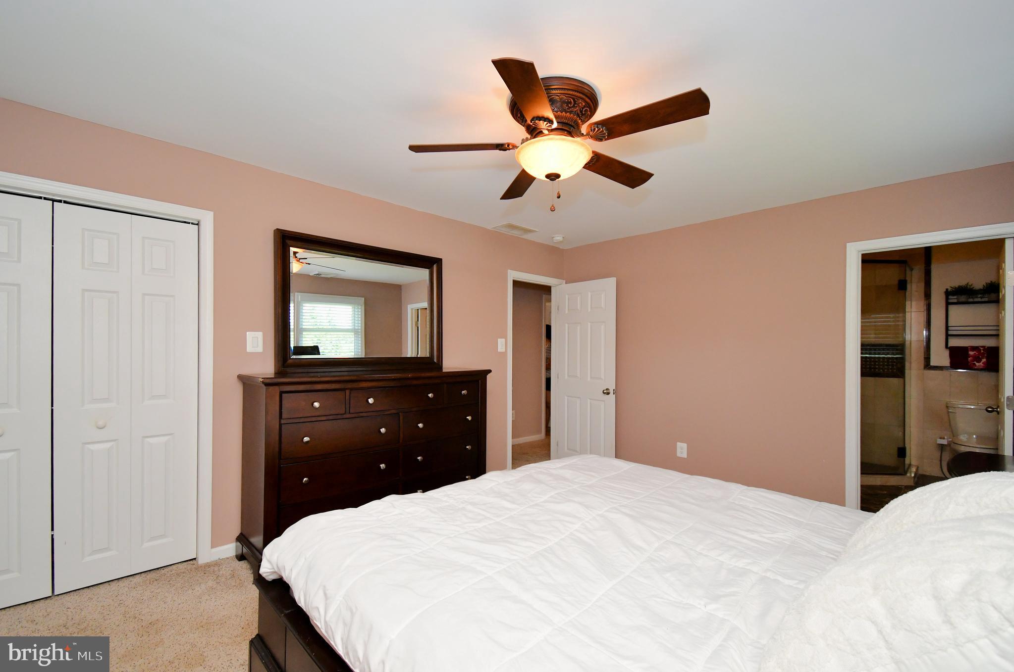 1014 Anna Road Huntingdon Valley, PA 19006 - Photo 45 of 54 a bedroom with a bed and a chandelier