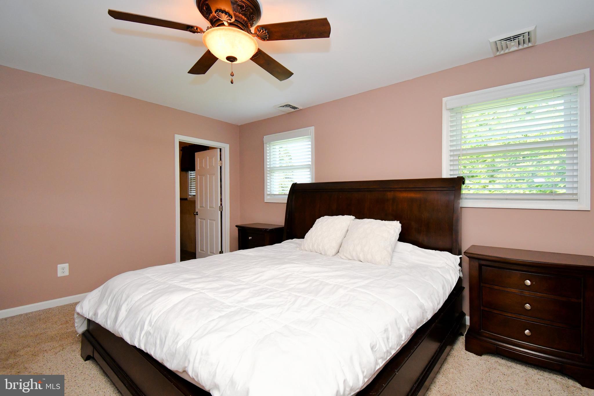 1014 Anna Road Huntingdon Valley, PA 19006 - Photo 46 of 54 a bedroom with a bed and a chandelier