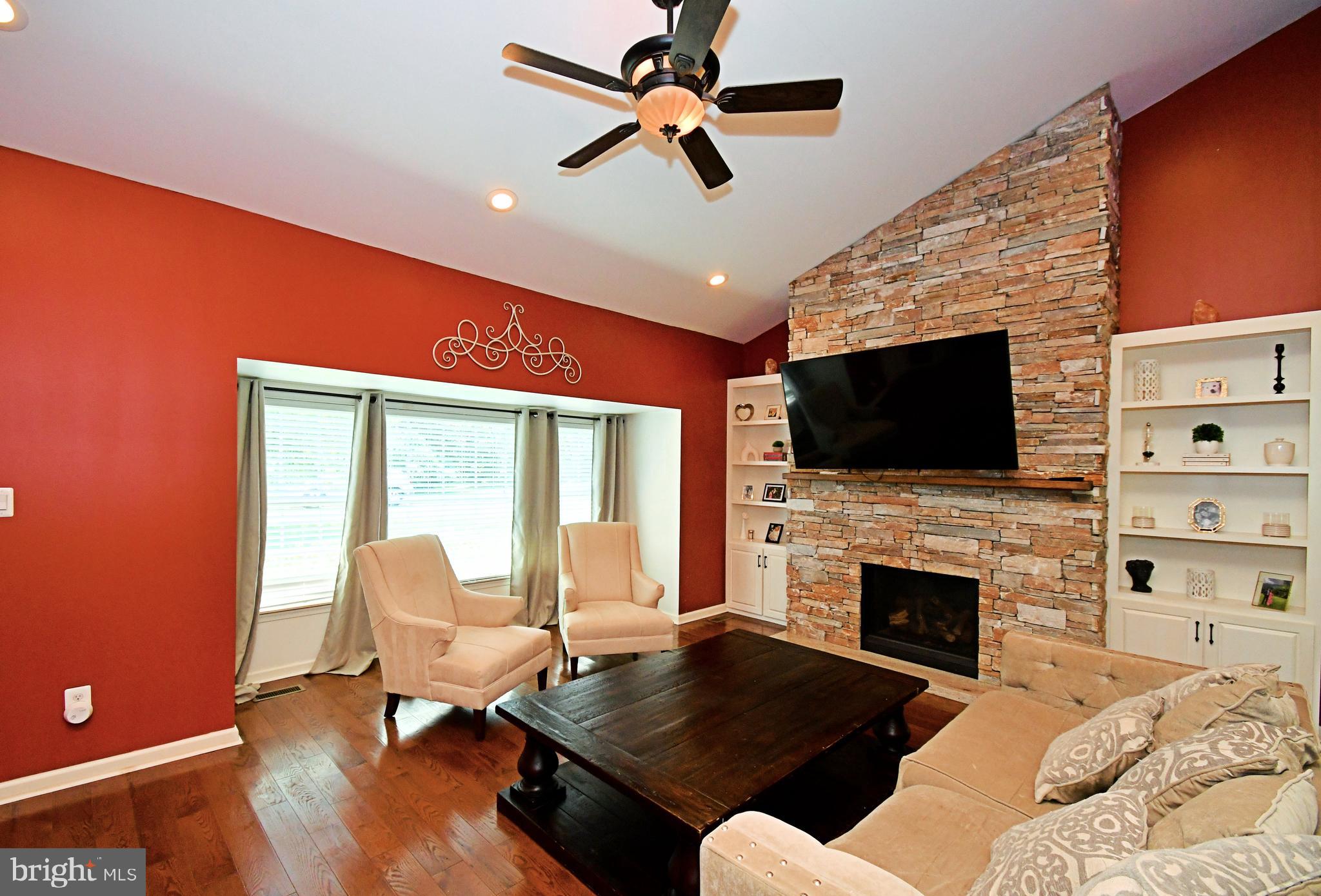 1014 Anna Road Huntingdon Valley, PA 19006 - Photo 7 of 54 a living room with furniture fireplace and flat screen tv