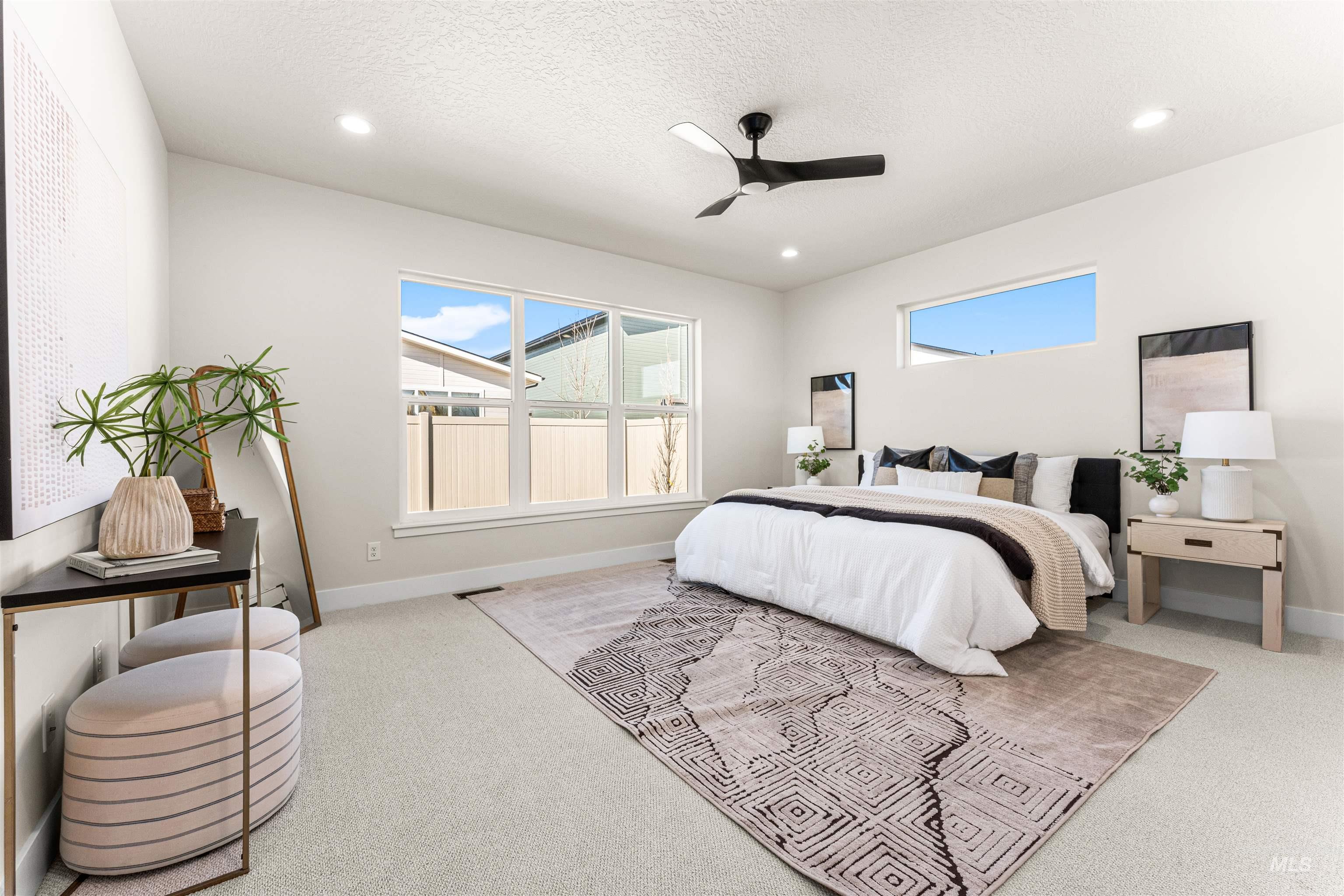 2787 West Warlander Street Meridian, ID 83642 - Photo 13 of 34 Bedroom featuring ceiling fan, light colored carpet, multiple windows, a textured ceiling, and recessed lighting