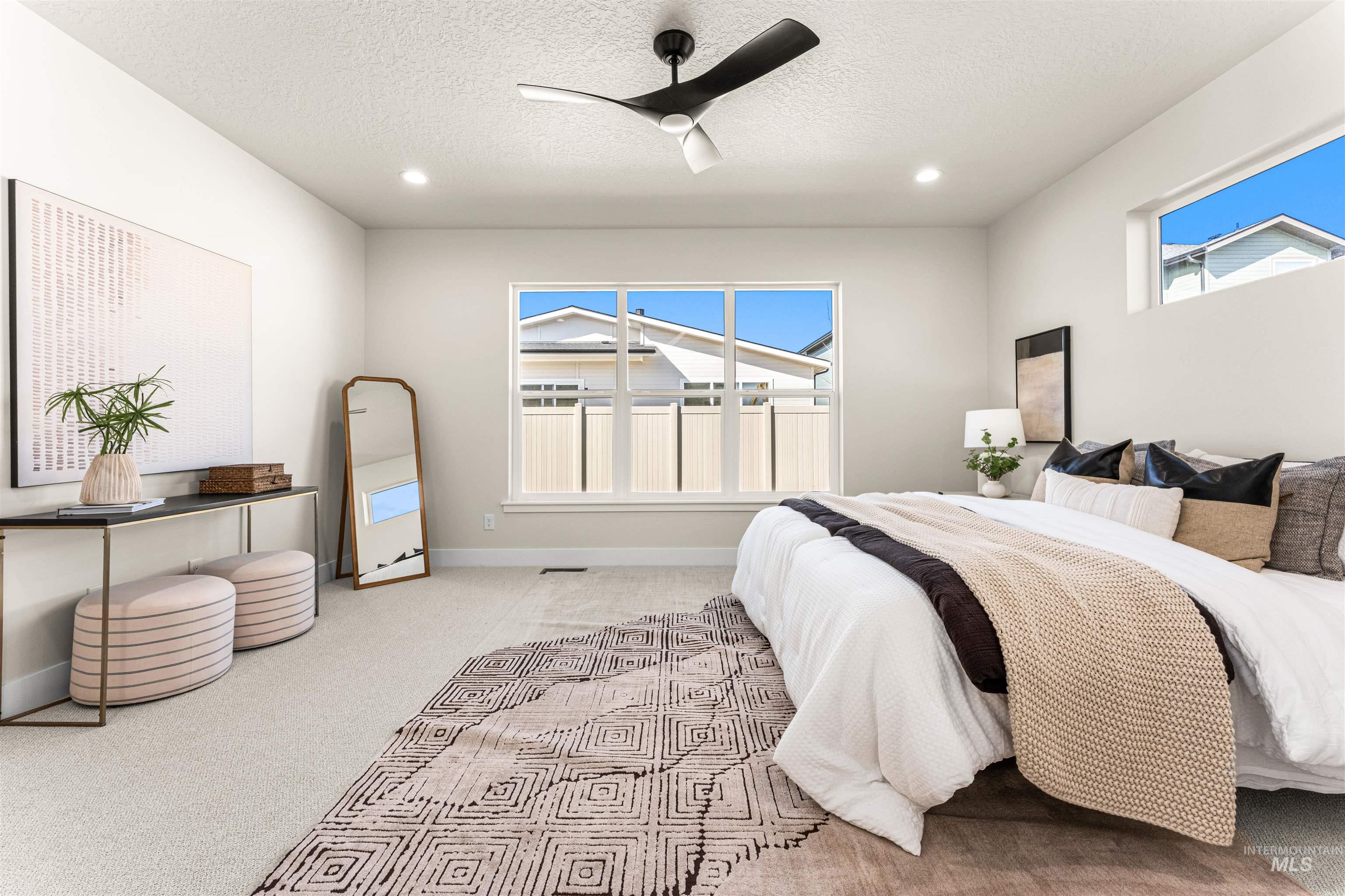 2787 West Warlander Street Meridian, ID 83642 - Photo 14 of 34 Bedroom featuring light colored carpet, ceiling fan, a textured ceiling, and recessed lighting