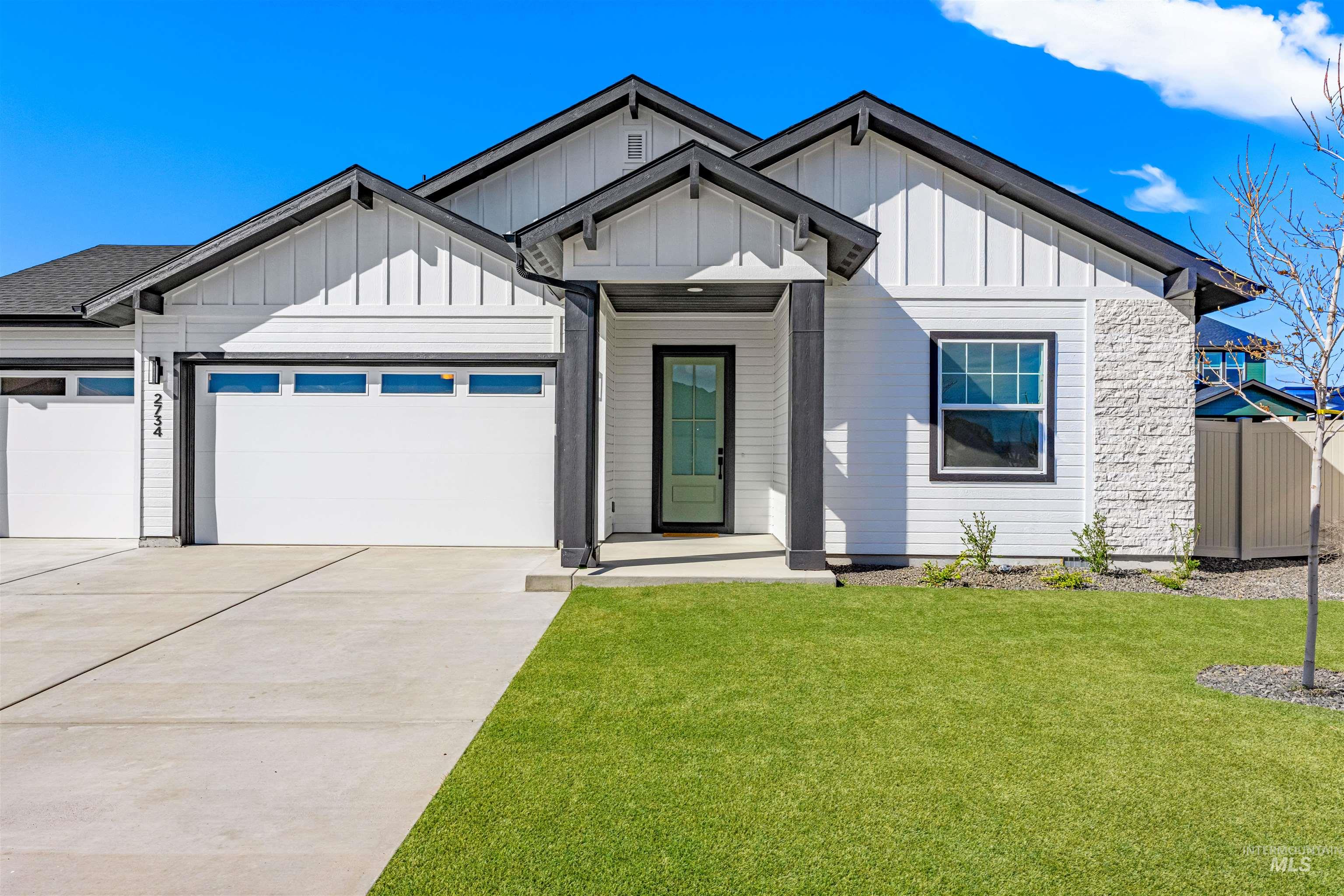 2787 West Warlander Street Meridian, ID 83642 - Photo 2 of 34 Modern inspired farmhouse featuring an attached garage, board and batten siding, and driveway